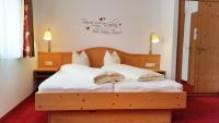 Łóżko lub łóżka w pokoju w obiekcie Das Wismeyer - Skihotel an der Plattenkarbahn