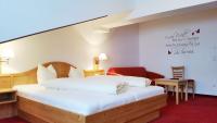 Łóżko lub łóżka w pokoju w obiekcie Das Wismeyer - Skihotel an der Plattenkarbahn