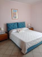 A bed or beds in a room at Casa Tonia