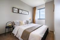 Postel nebo postele na pokoji v ubytování Amazingly UNIXX 2 Bedroom Condo in Pattaya