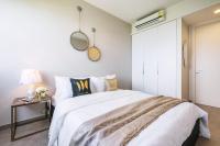 Postel nebo postele na pokoji v ubytování Amazingly UNIXX 2 Bedroom Condo in Pattaya