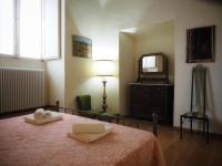 Łóżko lub łóżka w pokoju w obiekcie Palazzo Bianchi Bandinelli by FrancigenaApartments