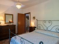 Łóżko lub łóżka w pokoju w obiekcie Holiday Home La Badia by Interhome