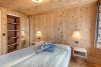 Posteľ alebo postele v izbe v ubytovaní Appartamento Nonna Engadina Chalet