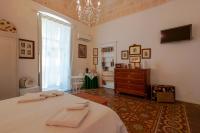 Televízia a/alebo spoločenská miestnosť v ubytovaní B&B Il Melograno Taranto