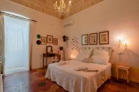 Posteľ alebo postele v izbe v ubytovaní B&B Il Melograno Taranto