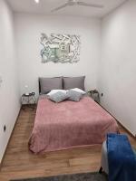 Posteľ alebo postele v izbe v ubytovaní Apartman Julija 2