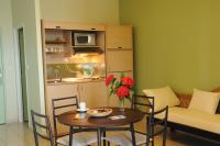 a living room with a table and a couch at Hotel Maharajah in Mamoudzou