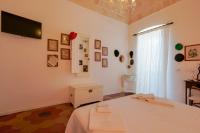 Posteľ alebo postele v izbe v ubytovaní B&B Il Melograno Taranto