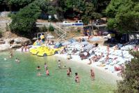 a group of people in the water at a beach at Apartments with a parking space Rabac, Labin - 7442 in Rabac