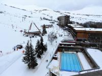 a ski resort with a swimming pool in the snow at Studio Le Corbier, 1 pièce, 5 personnes - FR-1-267-232 in Villarembert