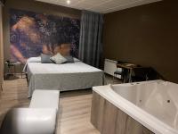 A bed or beds in a room at Motel Los Abedules