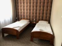 Postel nebo postele na pokoji v ubytování Hotel Krystyna