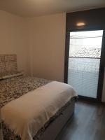 Postel nebo postele na pokoji v ubytování Apartament Cèntric a Ribes de Freser Vall de Núria