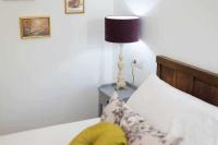 Postel nebo postele na pokoji v ubytování Room Boutique Calma Nerea By KubiK