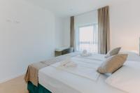 Posteľ alebo postele v izbe v ubytovaní Carmen Residence Apartments