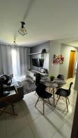 a living room with a table and chairs at Residencial Havaí in João Pessoa
