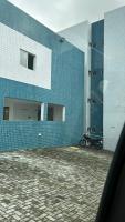 a motorcycle parked in front of a building at Residencial Havaí in João Pessoa