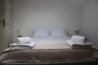 A bed or beds in a room at Urban Chic Apartments Lefkada