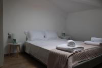A bed or beds in a room at Urban Chic Apartments Lefkada