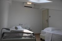 A bed or beds in a room at Urban Chic Apartments Lefkada
