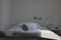 A bed or beds in a room at Urban Chic Apartments Lefkada