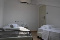 A bed or beds in a room at Urban Chic Apartments Lefkada