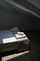 A bed or beds in a room at Urban Chic Apartments Lefkada