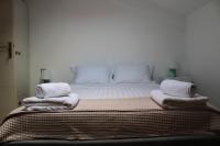 A bed or beds in a room at Urban Chic Apartments Lefkada