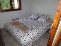Łóżko lub łóżka w pokoju w obiekcie Chalet Le Tyrolien, au coeur du Boréon