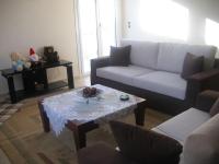 A seating area at Ήσυχο οικογενειακό σπίτι.