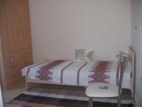A bed or beds in a room at Ήσυχο οικογενειακό σπίτι.