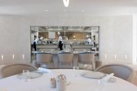 a restaurant with two chefs in the kitchen at Fleur de Loire in Blois