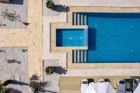 an overhead view of a swimming pool at a resort at Vita Residence, a Charming Family Escape,By ThinkVilla in Pangalochori
