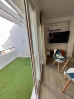 TV a/nebo společenská místnost v ubytování Apartamentos Buganvilla Roquetas de Mar