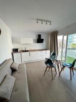 TV a/nebo společenská místnost v ubytování Apartamentos Buganvilla Roquetas de Mar