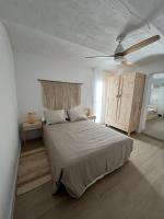 Postel nebo postele na pokoji v ubytování Apartamentos Buganvilla Roquetas de Mar