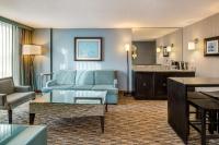 a living room with a couch and a table at Crowne Plaza Chicago O'Hare Hotel & Conference Center by IHG in Rosemont