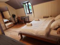 Łóżko lub łóżka w pokoju w obiekcie Gite Pyrénées pleine nature jacuzzi 4/5 pers.