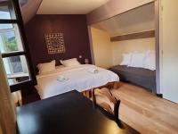 Łóżko lub łóżka w pokoju w obiekcie Gite Pyrénées pleine nature jacuzzi 4/5 pers.