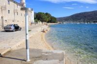 a car parked on the side of a body of water at Apartments by the sea Cres - 8095 in Cres