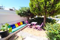 A garden outside La Brezza Suite & Hotel