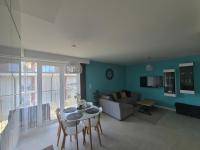Televízia a/alebo spoločenská miestnosť v ubytovaní Apartament Holiday 32