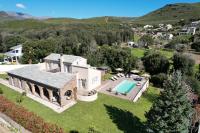 an aerial view of a house with a swimming pool at Les 5 Arches in Sisco