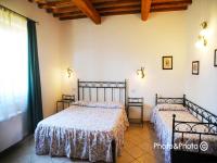 Saturnia Pian Di Catavernaにあるベッド