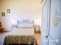 Saturnia Pian Di Catavernaにあるベッド