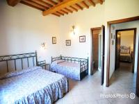 Saturnia Pian Di Catavernaにあるベッド