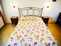 Saturnia Pian Di Catavernaにあるベッド