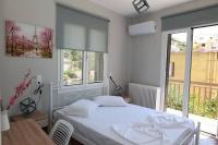 Posteľ alebo postele v izbe v ubytovaní Beautiful apartment in Plomari
