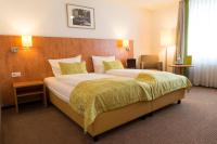 Postel nebo postele na pokoji v ubytování Hotel Mingarden